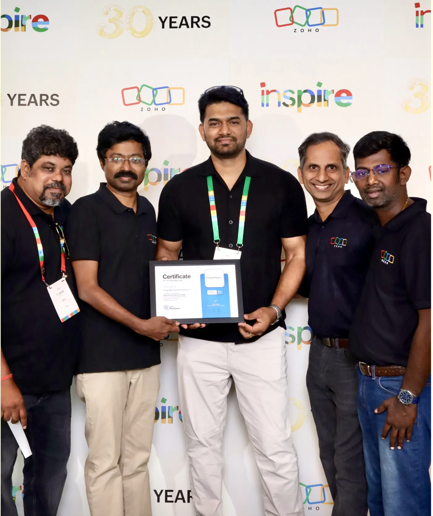 ThoughtLogik receiving Zoho Premium Partner tier recognition at Zoho Inspire